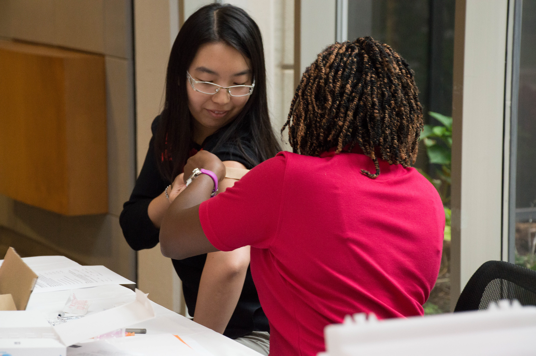 Oklahoma Medical Research Foundation Post-Doctoral Fellow Yao Fu receives her annual flu shot.