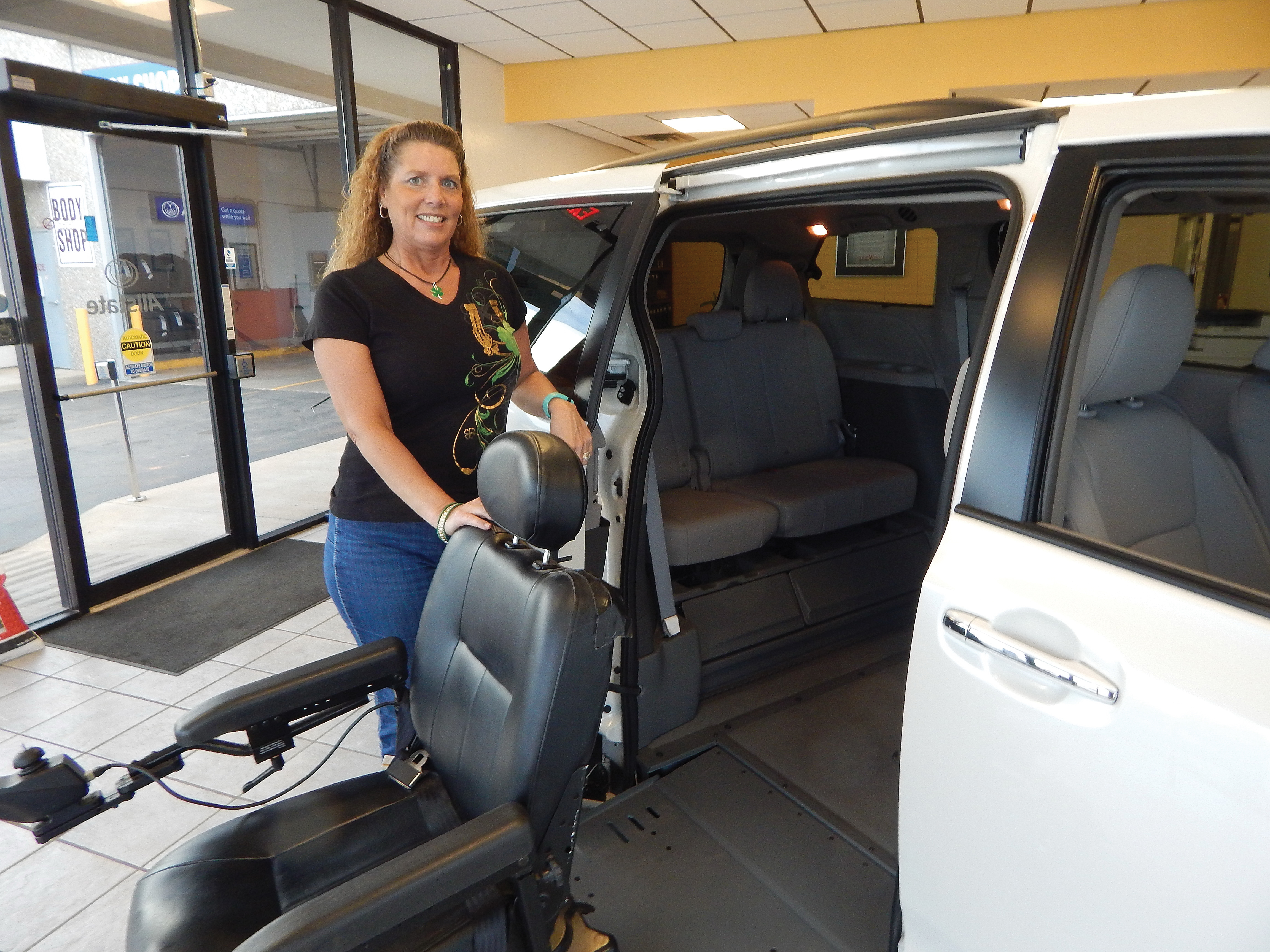 Lori Forston, office manger for Newby Vance Mobility Sales in Guthrie stands beside the BraunAbility which is one of many diverse products offered at the dealership.