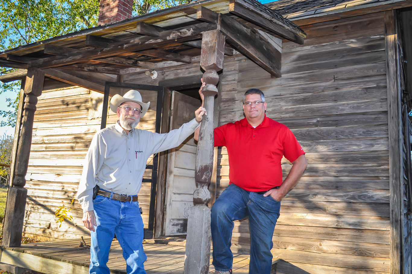 Myron January, 77, (left) and Moore City Councilman Mark Hamm are intent on preserving the history of Moore along with this 400-square foot house that dates back to early 1890.